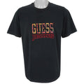 Guess - Black Embroidered Spell-Out T-Shirt 1990s Large Vintage Rero