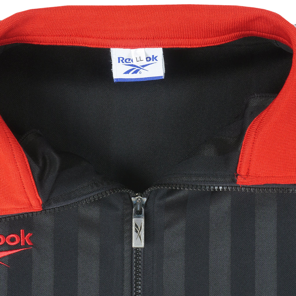 Reebok - Black & Red Spell-Out Track Jacket 1990s Large Vintage Retro