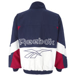 Reebok - Blue Embroidered Big Logo Windbreaker 1990s Medium Vintage Retro