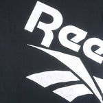 Reebok - Black Big Spell-Out T-Shirt 1990s Large Vintage Retro