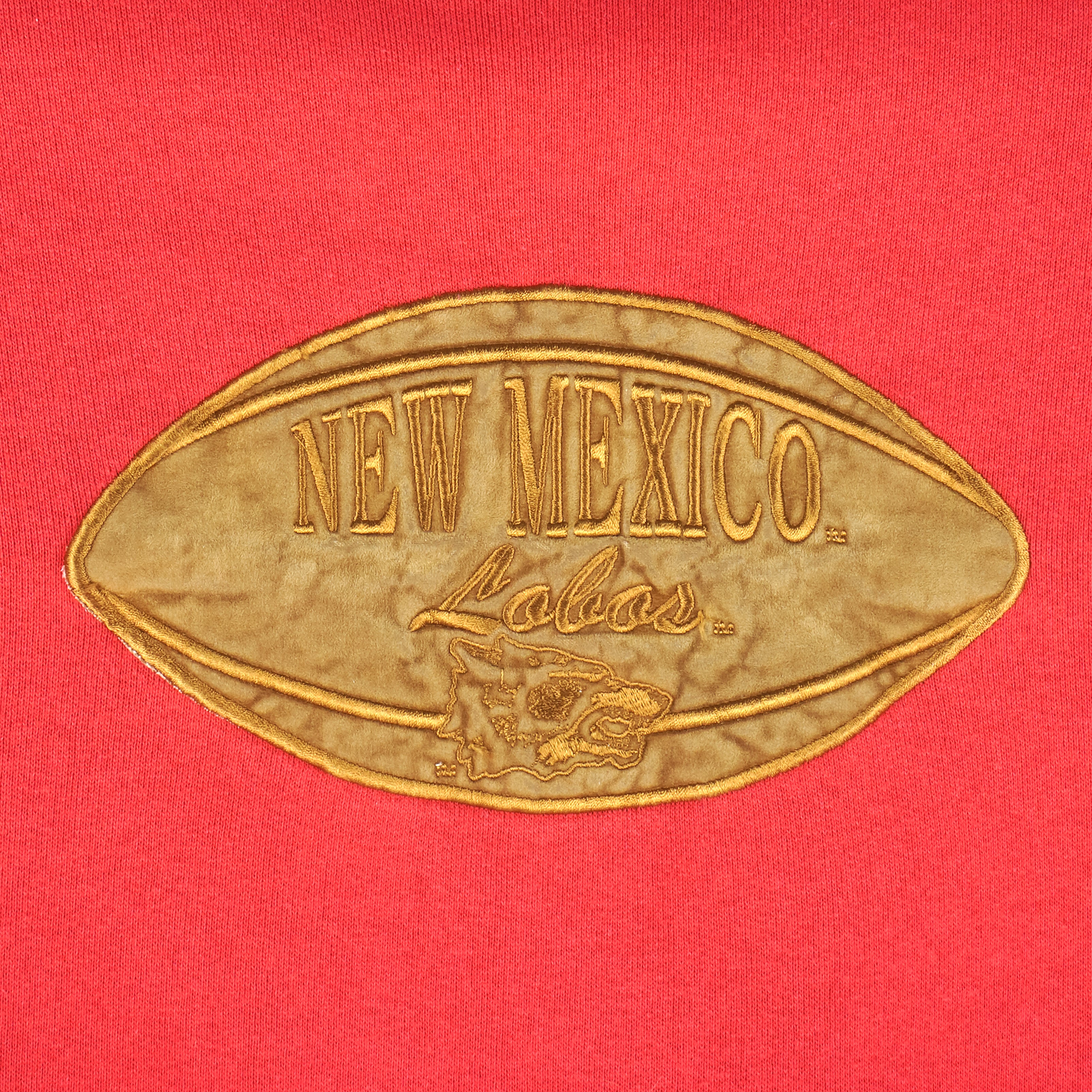 New Mexico Lobos embroidered football-shaped chest logo detail